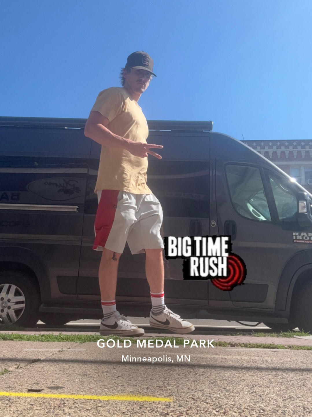 A player posing on a sidewalk in front of the van in Minneapolis, Minnesota